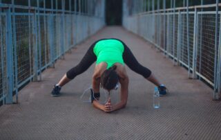does a cool down prevent injury girl stretching after run Propel Physiotherapy