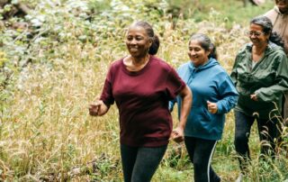 Friends out for a hike together. Make exercise fun. How to eliminate barriers to physical activity for people with brain injuries.
