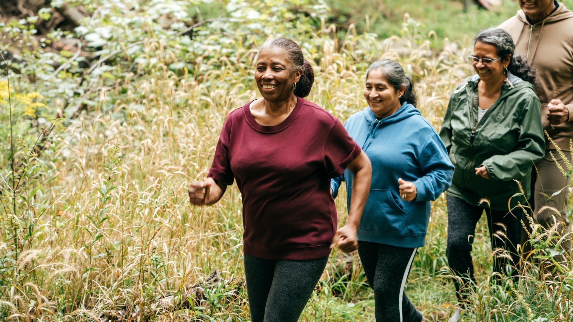 Friends out for a hike together. Make exercise fun. How to eliminate barriers to physical activity for people with brain injuries.