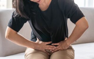 Woman experiencing pelvic pain. Pudendal neuralgia treatment Propel Physiotherapy