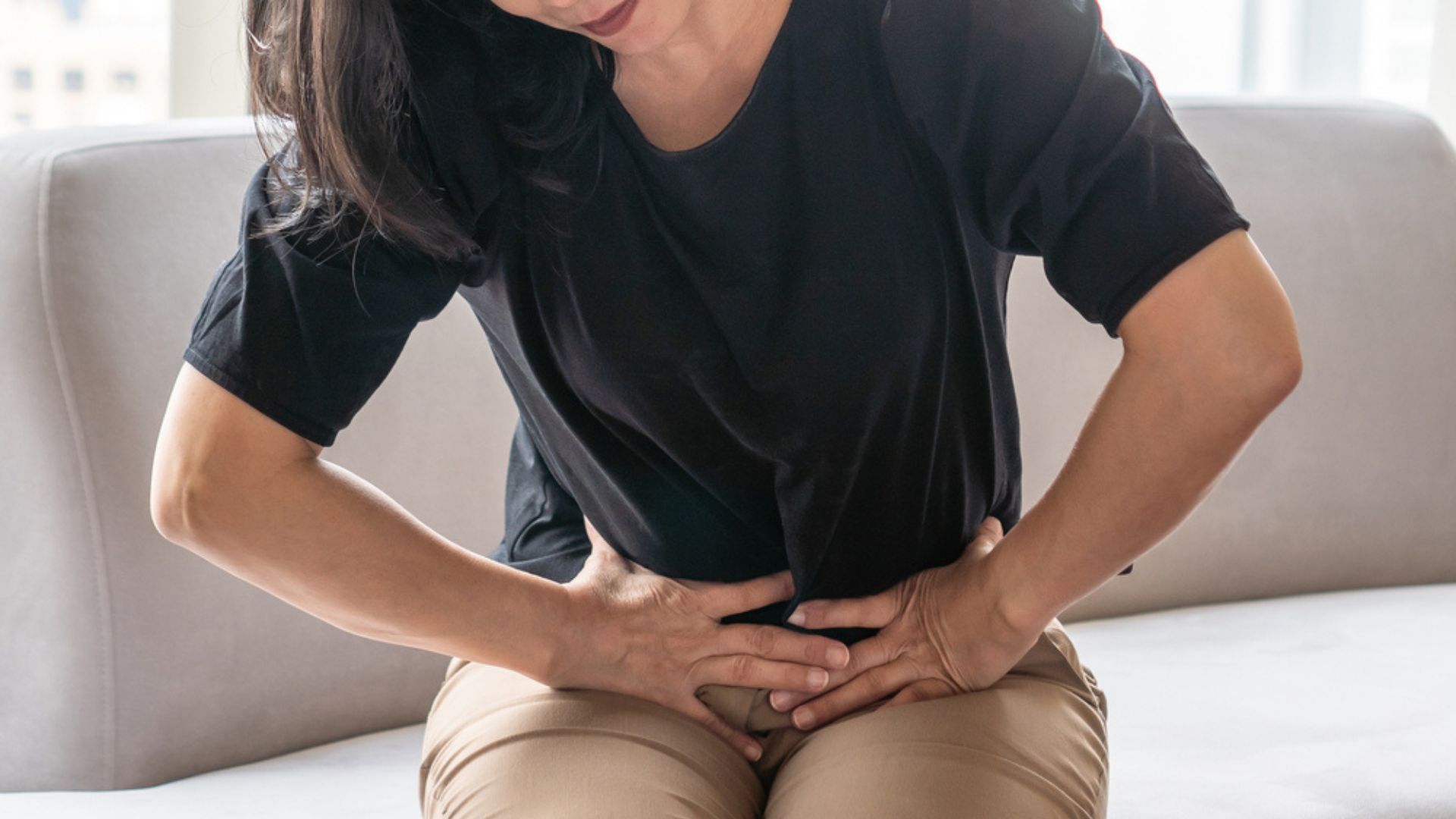 Woman experiencing pelvic pain. Pudendal neuralgia treatment Propel Physiotherapy