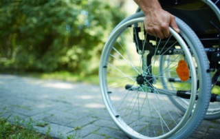 Man in wheelchair. Wheelchair propulsion techniques to prevent shoulder injuries Propel Physiotherapy.