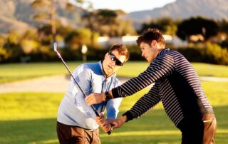 Man having golf swing technique lesson. Chiropractic care for golfers Propel Physiotherapy.