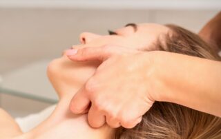 Woman receiving lymphatic drainage massage therapy at Propel Physiotherapy.
