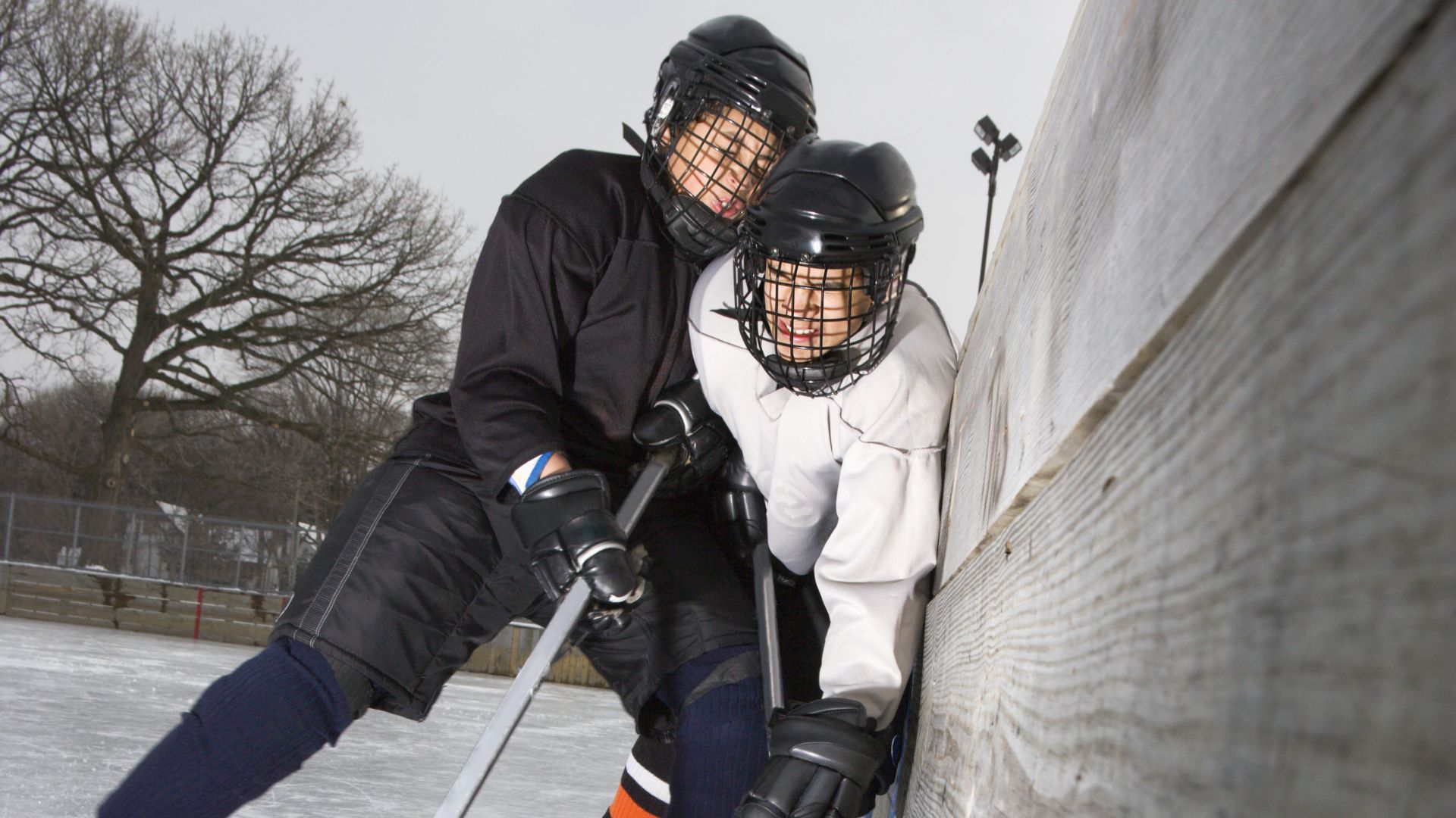 Youth hockey player bodychecking opponent into boards. Chronic traumatic encephalopathy (CTE) risk. How to prevent concussion in youth hockey. Concussion management Propel Physiotherapy.