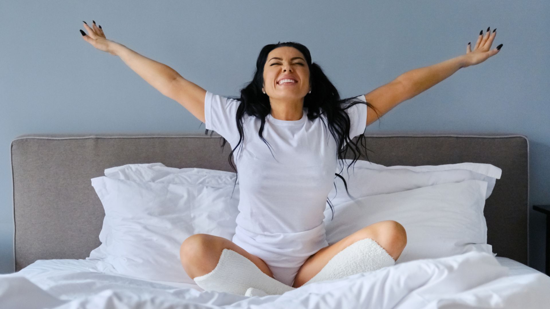 Woman wakes up refreshed after good night's sleep. Why sleep is critical for brain health. Propel Physiotherapy | Etobicoke | Pickering | Peterborough.