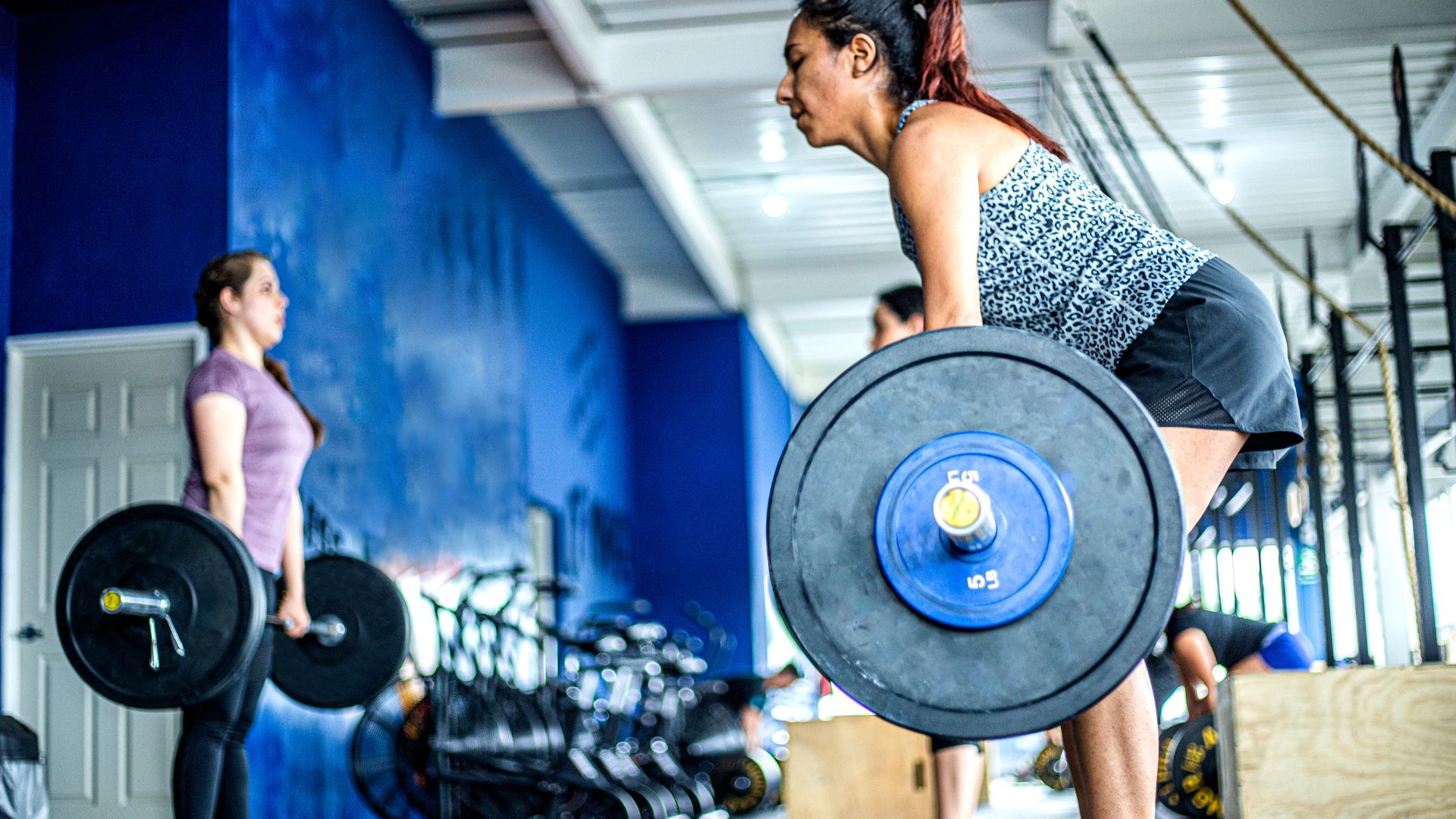 Women weightlifting at the gym. Why women should lift heavy weights. Propel Physiotherapy personal training and exercise programming.