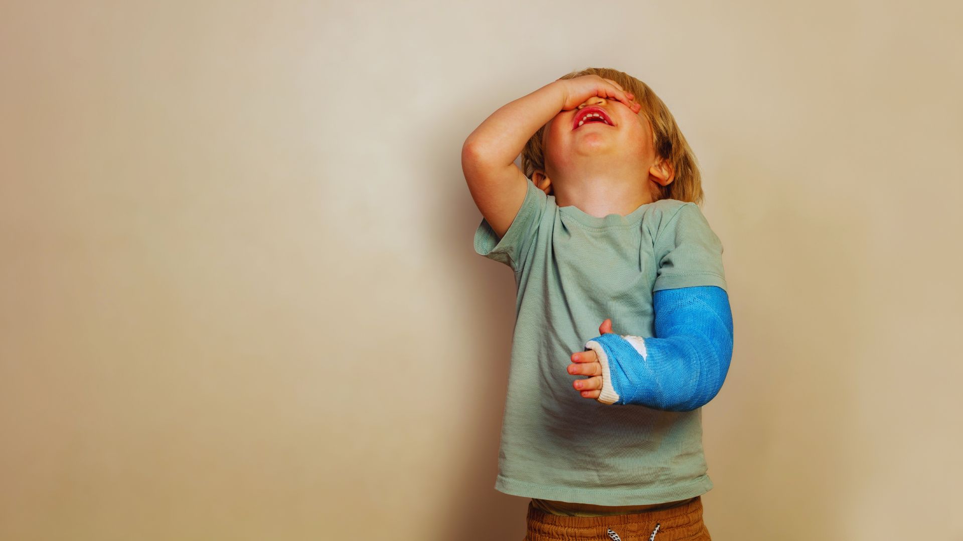 Young boy with a broken elbow. Pediatric fracture rehabilitation at Propel Physiotherapy.