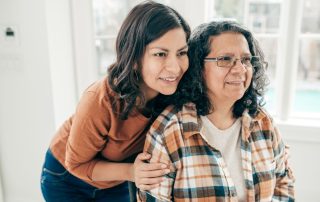 Daughter embracing mother. The role of caregiver in brain injury rehabilitation. Propel Physiotherapy.