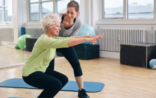 Senior woman with osteoporosis doing session with physiotherapist. How physiotherapy helps reduce osteoporosis-related falls. Propel Physiotherapy.