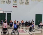 A group of wheelchair basketball players on the court. Wheelchair basketball: rules, how to train and injury prevention strategies from Propel Physiotherapy.