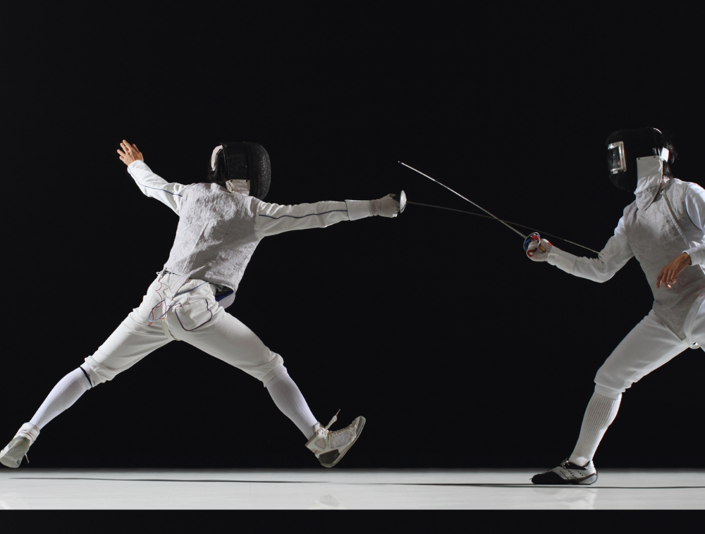Two people fencing. Bastien Moineau registered physiotherapist Propel Physiotherapy Etobicoke enjoys fencing.
